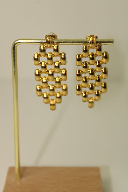 brinco xadrez dourado